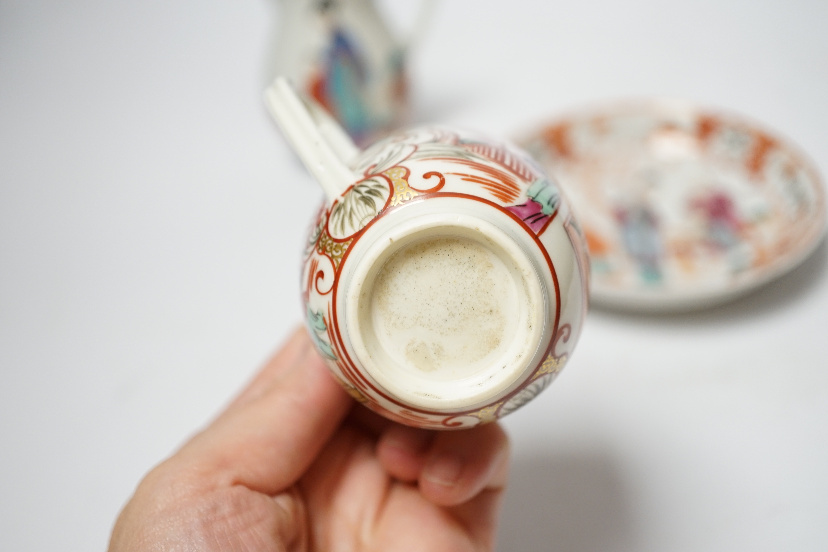 A Worcester sparrowbeak jug and a similar coffee cup together with an 18th century Chinese export saucer, 13cm diameter